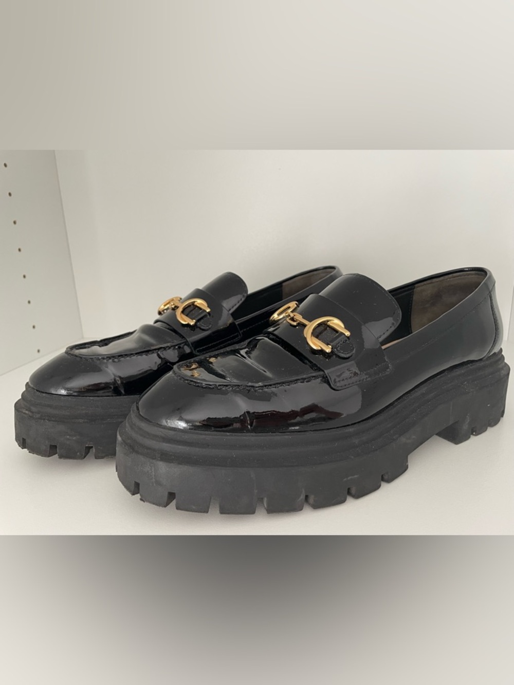 Stuart Weitzman Black Patent Leather Lug Sole Loafers with Gold Hardware